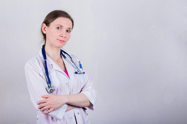 Female doctor on gray background