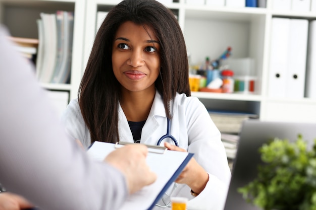 Female doctor hand hold silver pen and showing