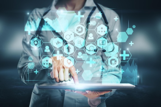 Female doctor hand using tablet with medical interface on blurry Medicine and healthcare concept Double exposure