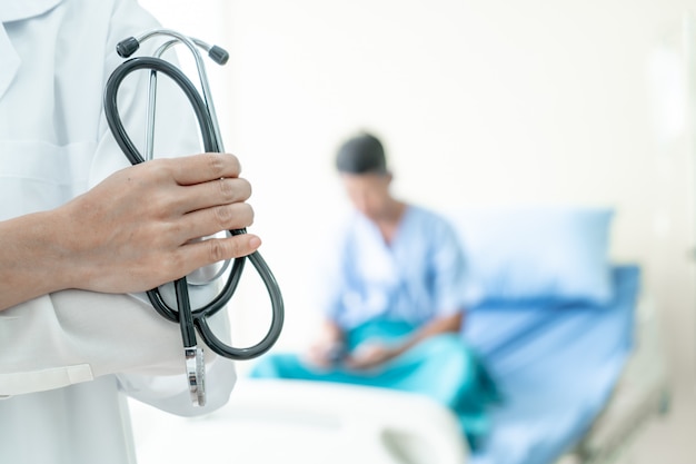 female doctor holding stethoscope