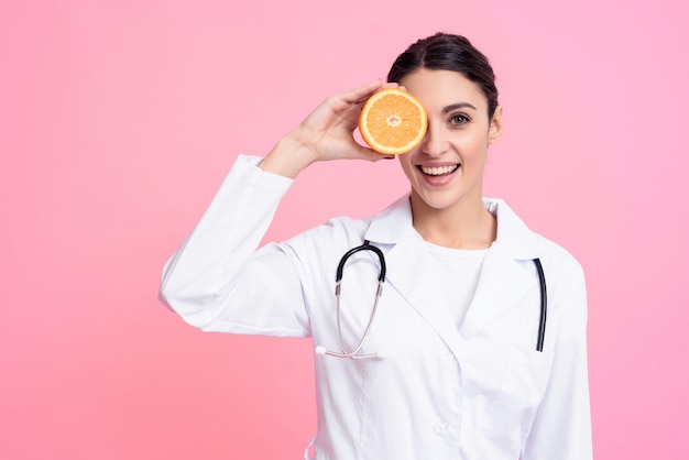 Female Doctor is Holding Orange