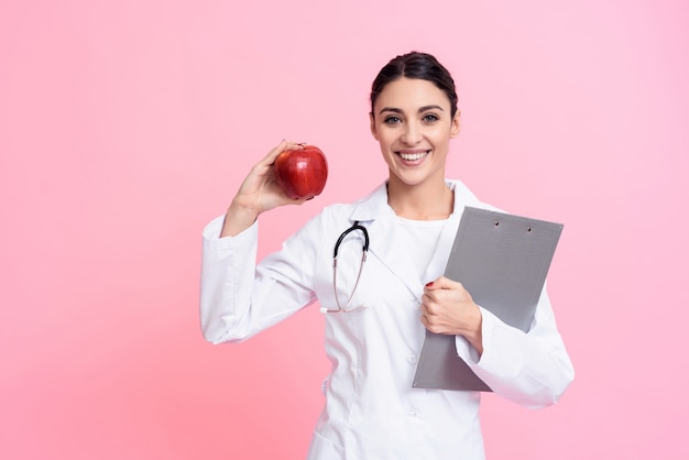 Female Doctor is Holding Red Apple