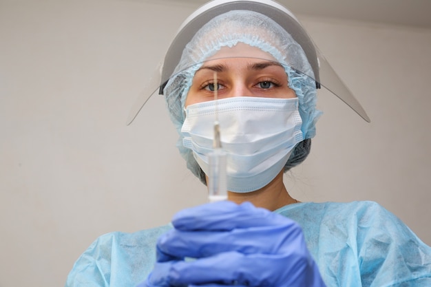 Female doctor in a protective suit