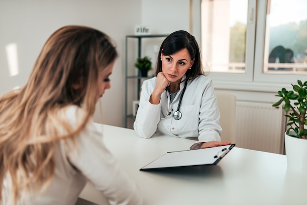 Female doctor talking to her patient.