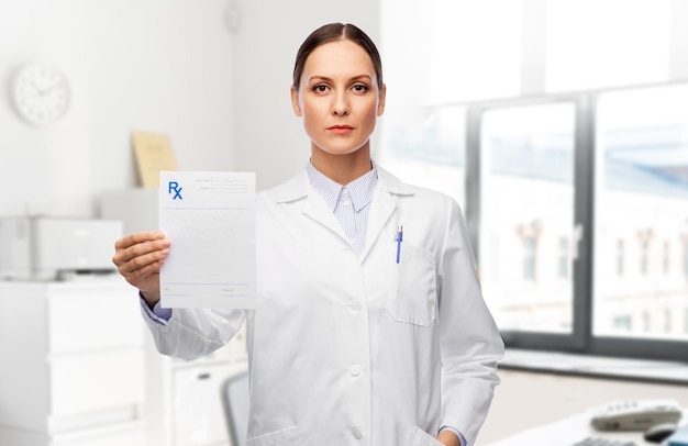 female doctor with prescription blank