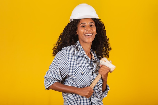 Female engineer holding a sledgehammer