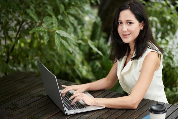 Female Entrepreneur Working on Laptop