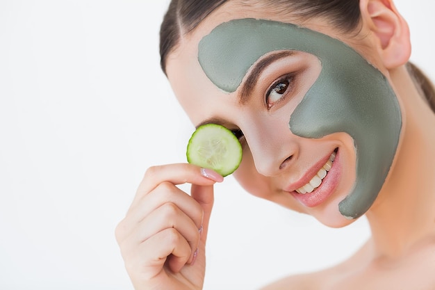 Female face with perfect skin and gray spa mask