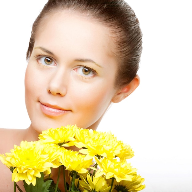 Female face with the yellow chrysanthemum