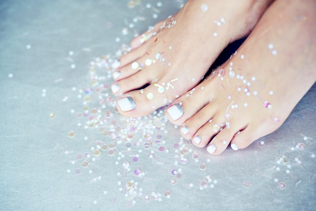 Female feet with colored pedicure