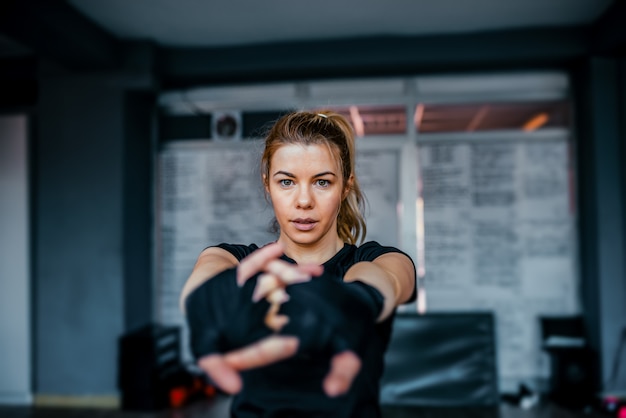 Female fighter stretching.