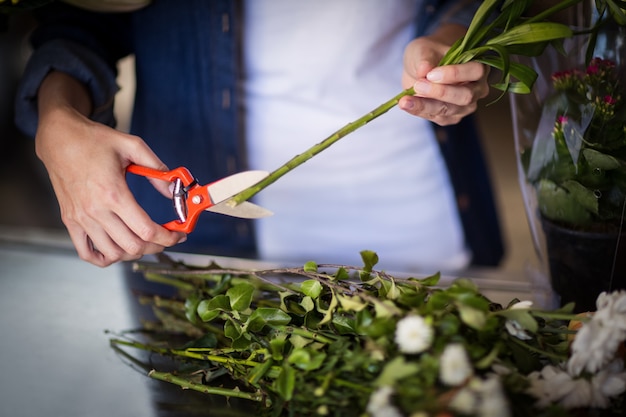 Female florist preparing flower bouquet