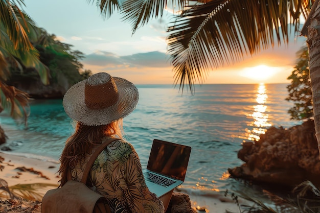 Female freelancer with laptop on the beach during sunset place of work of a hermit freelancer