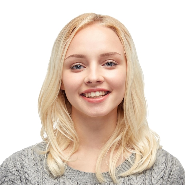 female, gender, fashion, portrait and people concept - smiling young woman or teenage girl in gray pullover