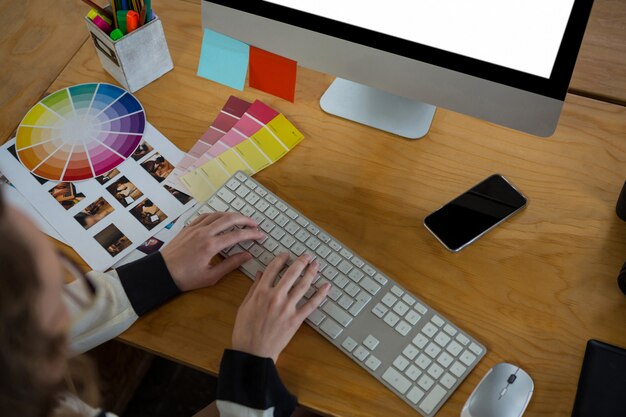 Female graphic designer working at desk