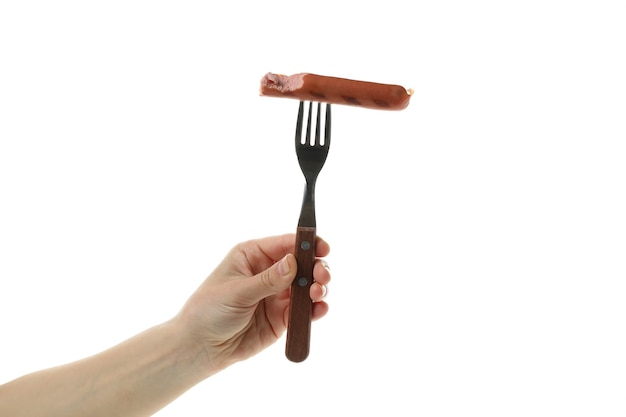 Female hand hold fork with grilled sausage, isolated on white background