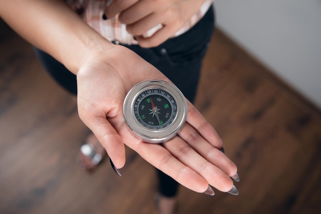 Female Hand Holding Compass In Hand