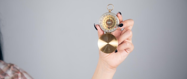 Female Hand Holding Compass In Hand