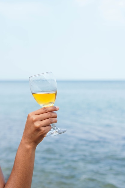 Female hand holding a glass of wine