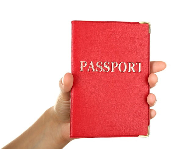 Female hand holding passport isolated on white