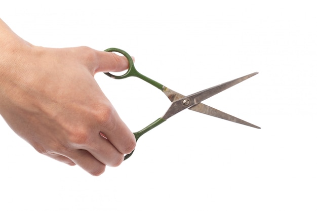 Female hand holding scissors, isolated on white