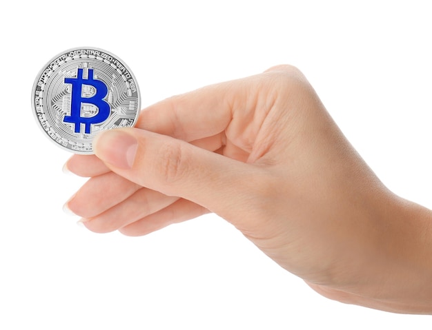 Female hand holding silver bitcoin on white background