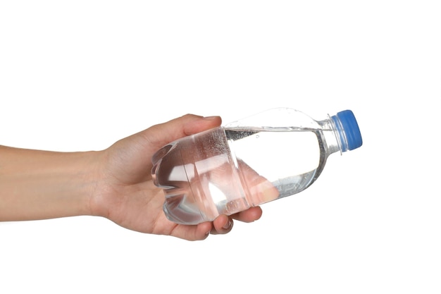 Female hand holds bottle of water isolated on white background