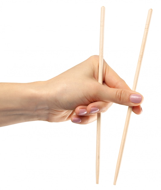 Female hand holds chopsticks