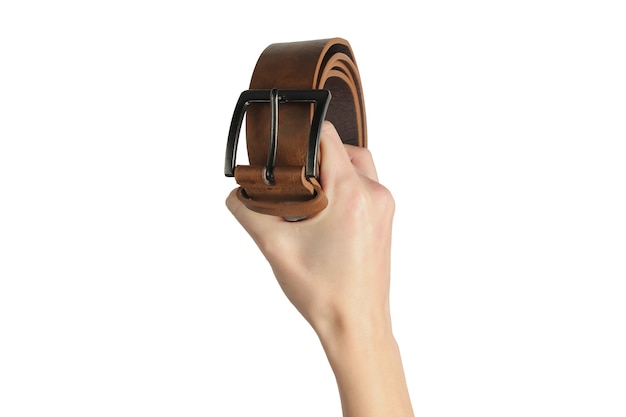 Female hand holds a leather brown belt isolated on white background