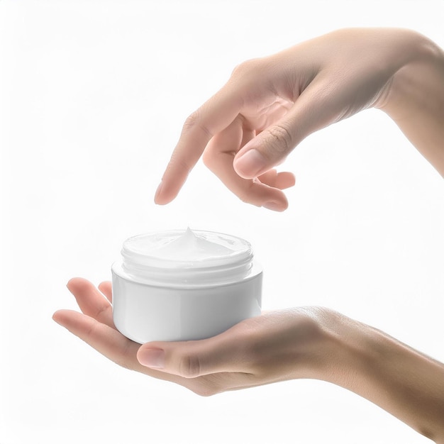 Female hand with bottle of cream on white background