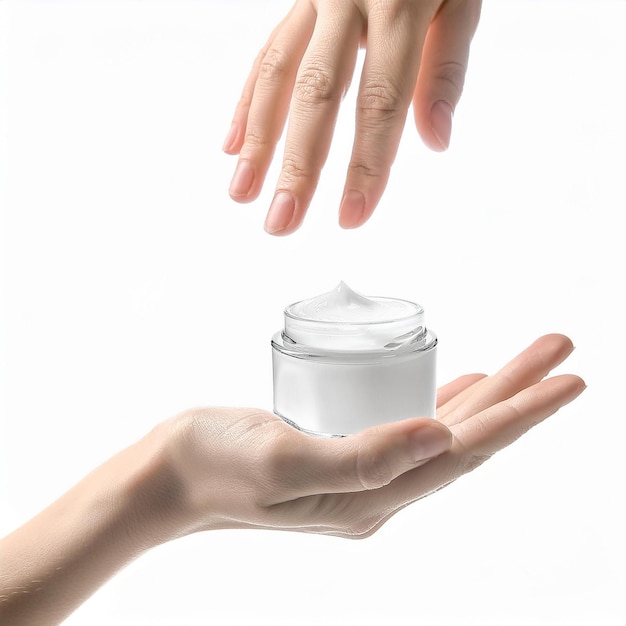 Female hand with bottle of cream on white background