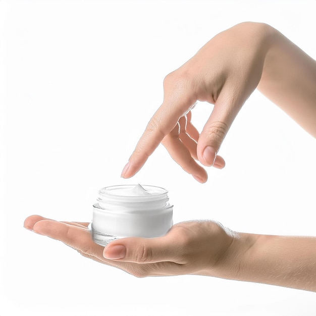 Female hand with bottle of cream on white background