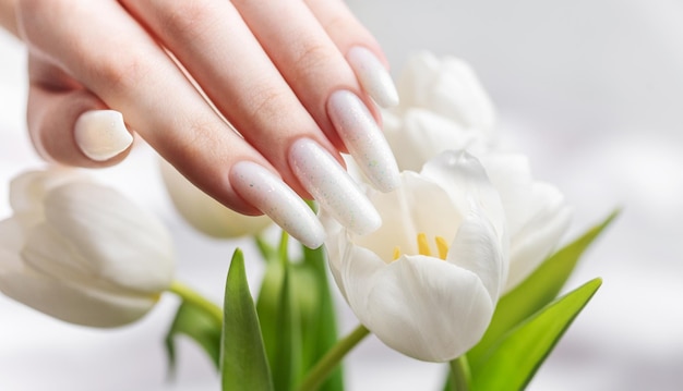 Female hand with spring nail design