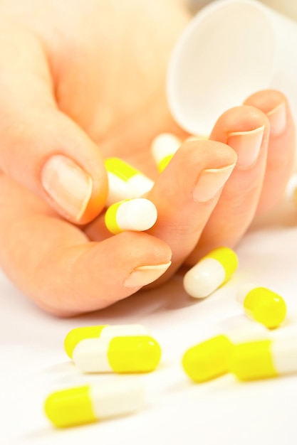 Female hand with tablets. Suicide.