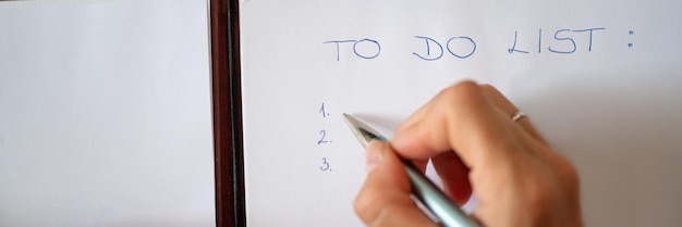 Female hand writing a To do list