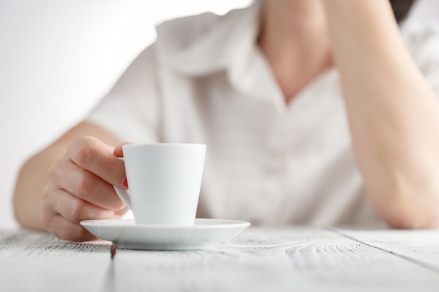 Female hands and cup of coffee