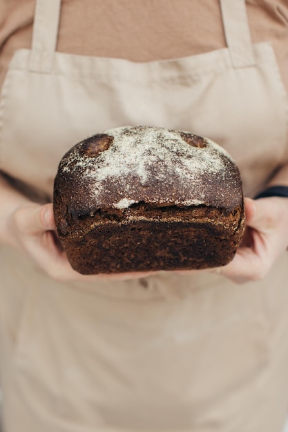 Female hands holding bread