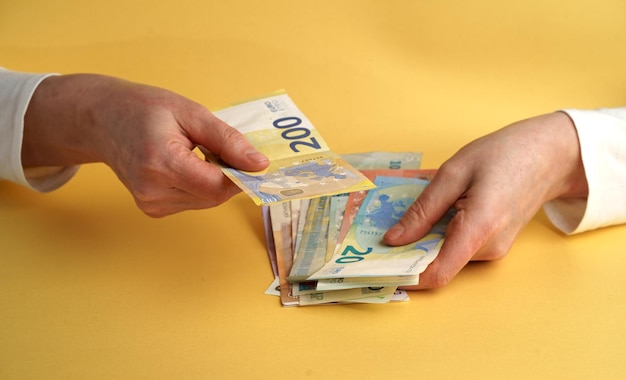 Female hands holding euro banknotes Euro Money