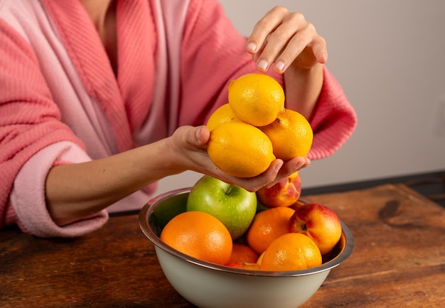 female hands holding lemons natural shot