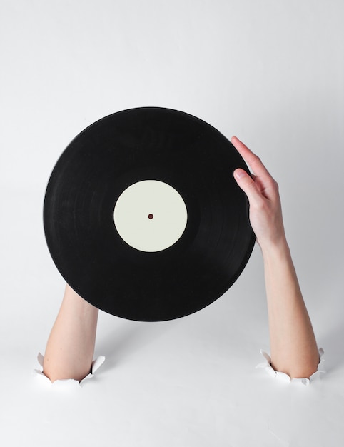 Female hands holding a vinyl record