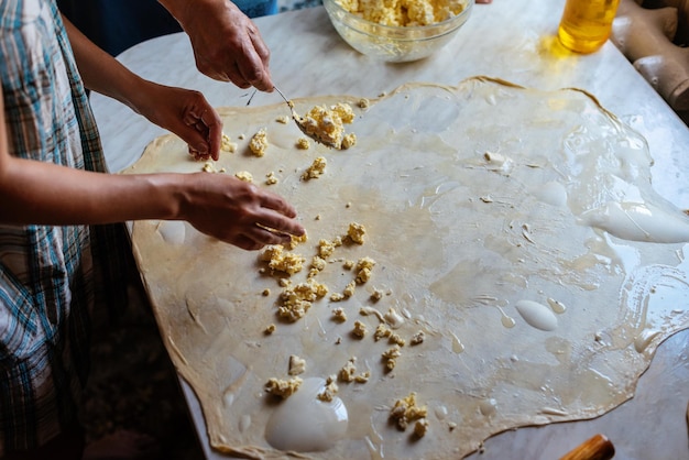 Female Hands Making Dough for baking Homemade Preparing Food Concept of the cooking process of baking homemade rolled borek pies