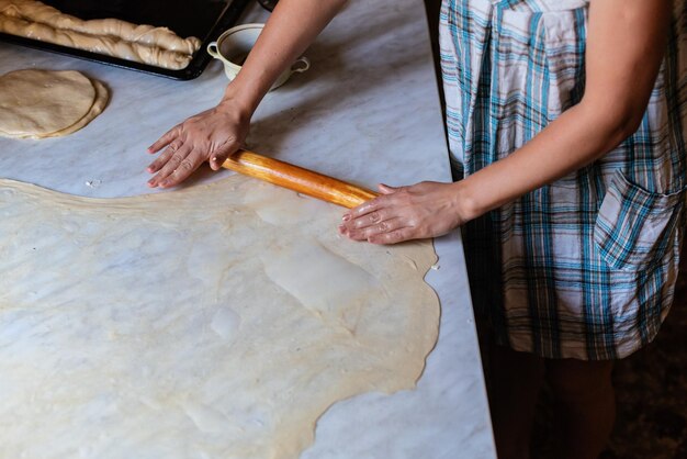 Female Hands Making Dough for baking Homemade Preparing Food Concept of the cooking process of baking homemade rolled borek pies