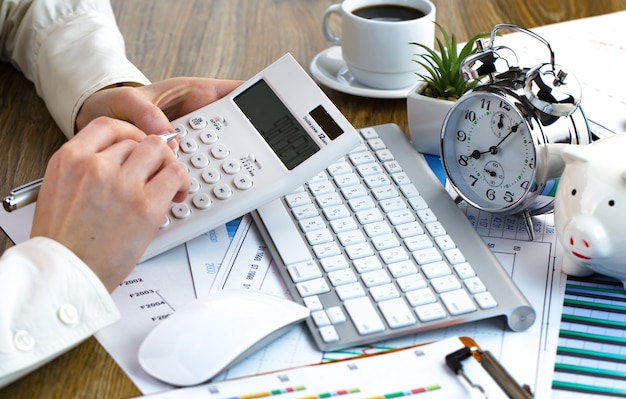 Female hands in the office with items for business