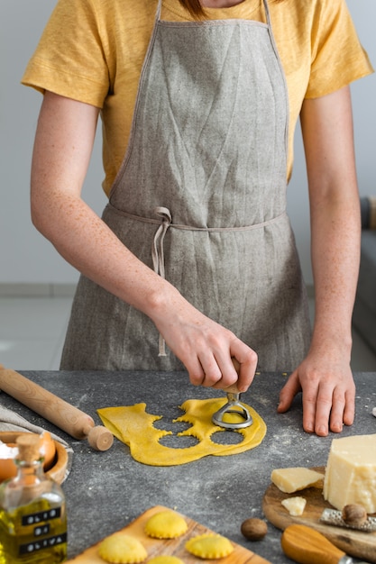 Female hands, process of preparation homemade italian pasta, ravioli