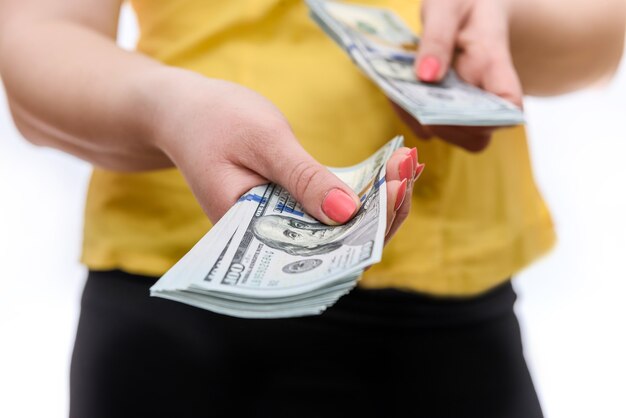 Female hands with american dollar banknotes close up