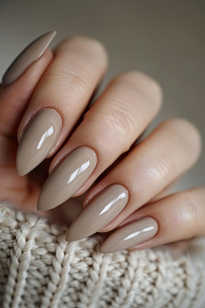 Female hands with beige nail design Brown manicure with varnish