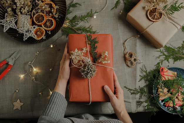 Female hands with Christmas gift