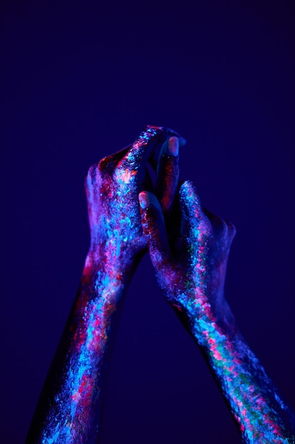 Female hands with fluorescent art in neon bold colors Modern psychedelic creative element