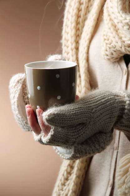 Female hands with hot drink