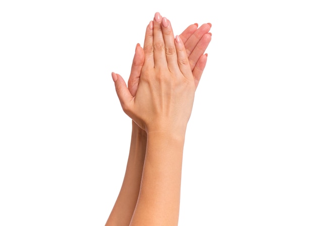 Photo female hands with manicure going to applause gesture and sign isolated on white background beautiful hands of woman with copy space